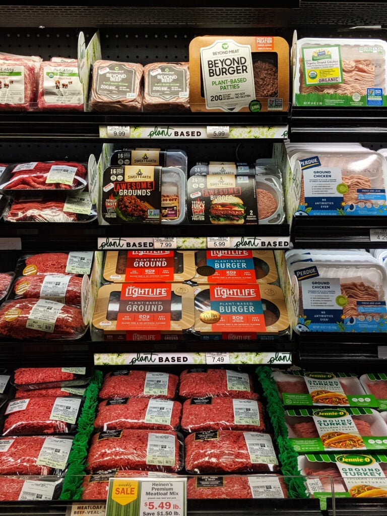 Plant-based meat shelved with conventional meat at heinen’s.