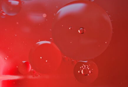 Closeup red bubbles oil with soft focus and blurred background ,
